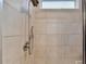 Close-up of a tiled shower with modern fixtures, providing a clean and inviting space for relaxation at 5452 Fountainhead Ln, Auburn, GA 30011