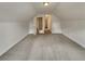Unfinished attic space with neutral carpet and ample storage opportunities at 6405 Beaver Creek Trl, Atlanta, GA 30349