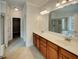 Bathroom with double vanity, tile floors, and ample storage at 6405 Beaver Creek Trl, Atlanta, GA 30349