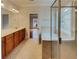 Bright bathroom featuring double vanity, tile floors, a soaking tub, and separate glass enclosed shower at 6405 Beaver Creek Trl, Atlanta, GA 30349