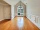 Elegant dining area with hardwood floors, large window, and modern chandelier at 6405 Beaver Creek Trl, Atlanta, GA 30349