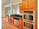 Well-equipped kitchen with stainless steel appliances, granite counters, and hardwood floors at 6405 Beaver Creek Trl, Atlanta, GA 30349