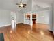 Open-concept living room featuring hardwood floors and view into the kitchen at 6405 Beaver Creek Trl, Atlanta, GA 30349