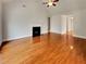 Bright living room with hardwood floors, fireplace, vaulted ceiling, and neutral paint at 6405 Beaver Creek Trl, Atlanta, GA 30349