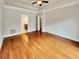 Spacious bedroom with tray ceiling, hardwood floors, and en-suite bathroom at 6405 Beaver Creek Trl, Atlanta, GA 30349