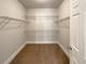 Walk-in closet with shelving and carpet at 6405 Beaver Creek Trl, Atlanta, GA 30349