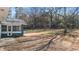 Large backyard with mature trees at 9588 Poston Rd, Jonesboro, GA 30238