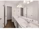 Large bathroom with double sinks, extended vanity, and ample lighting, perfect for morning routines at 9588 Poston Rd, Jonesboro, GA 30238