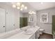 Spacious bathroom with double sink vanity, large mirror, and tiled shower, designed for comfort and convenience at 9588 Poston Rd, Jonesboro, GA 30238