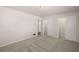 A tidy bedroom features carpet, two large closets, creating a serene and inviting space at 9588 Poston Rd, Jonesboro, GA 30238
