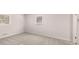 Bright bedroom with gray carpet and two windows providing natural light, perfect for rest and relaxation at 9588 Poston Rd, Jonesboro, GA 30238