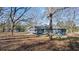 Quaint home with lots of mature trees on a large lot, located on a quiet street at 9588 Poston Rd, Jonesboro, GA 30238