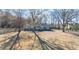 Inviting single-story home featuring mature trees and a sprawling front lawn at 9588 Poston Rd, Jonesboro, GA 30238