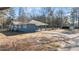 Charming single-story home featuring a covered carport and a long driveway at 9588 Poston Rd, Jonesboro, GA 30238