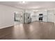 Spacious kitchen with stainless steel appliances, white cabinets, and hardwood floors at 9588 Poston Rd, Jonesboro, GA 30238