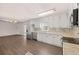 Modern kitchen features white cabinets and stainless-steel appliances at 9588 Poston Rd, Jonesboro, GA 30238