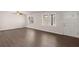 Living room with bright windows and new hardwood floors at 9588 Poston Rd, Jonesboro, GA 30238