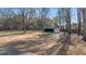 Detached garage with a covered area, offering ample storage and parking space at 9588 Poston Rd, Jonesboro, GA 30238