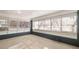 Bright sunroom filled with natural light from multiple windows and a rear entry door at 9588 Poston Rd, Jonesboro, GA 30238