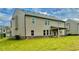 New construction home with brick base, siding and lush green lawn at 98 Longhorn Way, Auburn, GA 30011