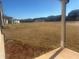 Expansive backyard view from the patio with newly laid sod and neighborhood homes at 98 Longhorn Way, Auburn, GA 30011