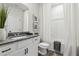 Bathroom with granite countertops, white cabinetry, toilet, and shower/tub combo at 98 Longhorn Way, Auburn, GA 30011