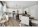 Bright kitchen with white cabinets, island seating, and modern appliances at 98 Longhorn Way, Auburn, GA 30011