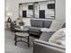 Comfortable living room boasts a plush gray sofa and artistic wall decor at 98 Longhorn Way, Auburn, GA 30011