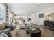 Open-concept living room flowing into the kitchen with plenty of light at 98 Longhorn Way, Auburn, GA 30011