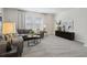 Inviting living room featuring stylish furnishings, neutral walls and soft, natural lighting at 98 Longhorn Way, Auburn, GA 30011