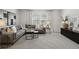 Bright living room features neutral décor, plush carpeting, and ample natural light at 98 Longhorn Way, Auburn, GA 30011