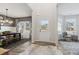 Open concept living area featuring stylish decor, luxury vinyl plank flooring, and sun-drenched windows at 98 Longhorn Way, Auburn, GA 30011