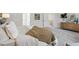 Comfortable main bedroom features a cozy throw and calming decor, ideal for relaxation at 98 Longhorn Way, Auburn, GA 30011