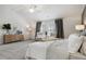 The stylish main bedroom offers ample space and pleasing furnishings, ideal for relaxation at 98 Longhorn Way, Auburn, GA 30011