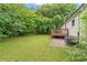 Large backyard with a deck and lush greenery surrounding the house at 1350 Redford Se Dr, Atlanta, GA 30315
