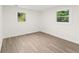 Bedroom with hardwood floors, two windows, and neutral paint at 1350 Redford Se Dr, Atlanta, GA 30315