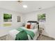 Brightly decorated bedroom featuring two bedside tables and lamps at 1350 Redford Se Dr, Atlanta, GA 30315