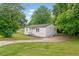 A charming single-story home features newly painted siding, a well maintained lawn and mature trees at 1350 Redford Se Dr, Atlanta, GA 30315