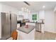 Modern kitchen features stainless steel appliances, an island with stone countertop, and plenty of cabinet space at 1350 Redford Se Dr, Atlanta, GA 30315