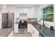 Modern kitchen features stainless steel appliances, sleek countertops, and ample cabinet space at 1350 Redford Se Dr, Atlanta, GA 30315