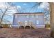 Exterior of home features a large deck with stair leading to backyard and lots of large windows at 1977 Nash Se Ave, Atlanta, GA 30316