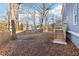 Backyard view showing lawn, fence line, and stair leading up to a deck on the back of the home at 1977 Nash Se Ave, Atlanta, GA 30316
