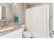 Cozy bathroom features granite countertops, a built-in sink, and a shower with a curtain at 1977 Nash Se Ave, Atlanta, GA 30316