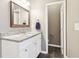 Bathroom featuring granite countertops, dark tile flooring, and white cabinetry at 1977 Nash Se Ave, Atlanta, GA 30316