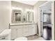Spacious primary bath with double vanity, granite countertops, and bright lighting at 1977 Nash Se Ave, Atlanta, GA 30316