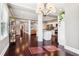 Open concept living space featuring a contemporary lighting fixture and rich hardwood floors at 1977 Nash Se Ave, Atlanta, GA 30316
