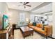 Bright living room with hardwood floors, a large sofa, and an open layout connecting to the kitchen at 1977 Nash Se Ave, Atlanta, GA 30316