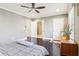 Spacious bedroom showcasing hardwood floors, ceiling fan, and ensuite bathroom access at 1977 Nash Se Ave, Atlanta, GA 30316