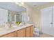 A bright bathroom with double sinks, shower with glass door, and neutral decor at 3845 New Salem Ct, Cumming, GA 30040