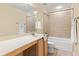 Bathroom featuring a shower over tub, tile flooring, towel racks, and a single vanity at 3845 New Salem Ct, Cumming, GA 30040